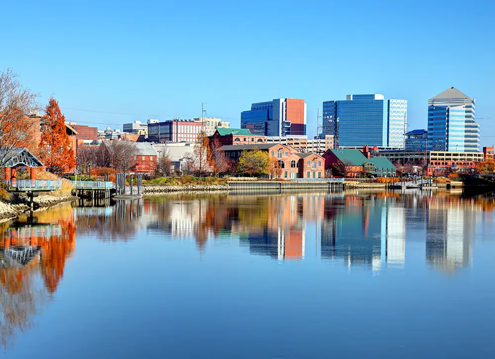 Photo of Wilmington, DE with reflection of buildings in water